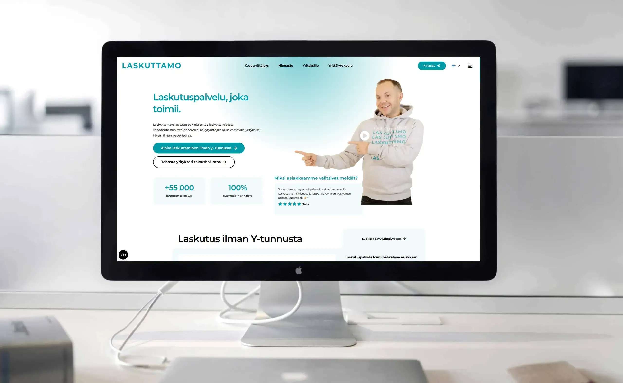 The Laskuttamo website displayed on a desktop monitor on a bright desk